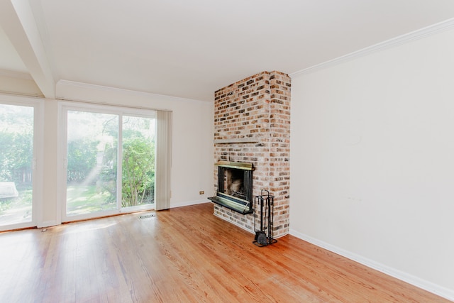 590 Green Bay Rd, Glencoe, IL 60022 - unfurnished living room with light wood finished floors, a fireplace, and ornamental molding