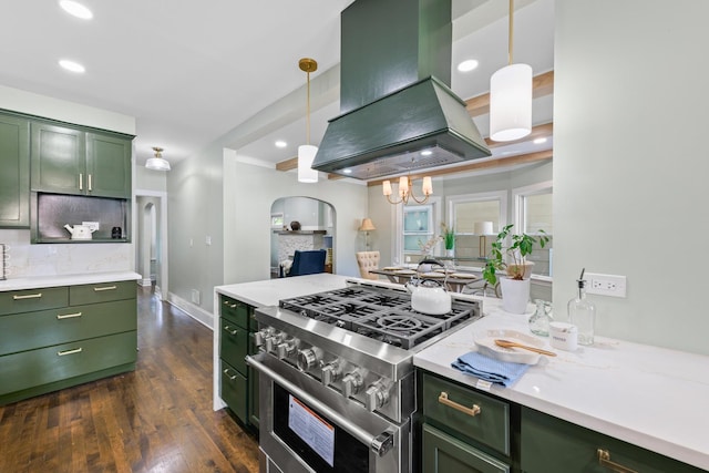605 Home Ave, Oak Park, IL 60304 - kitchen featuring green cabinets, exhaust hood, high end range, dark wood-style floors, and hanging light fixtures