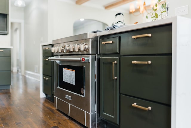 605 Home Ave, Oak Park, IL 60304 - kitchen with dark wood-style flooring, green cabinetry, stainless steel stove, and light countertops