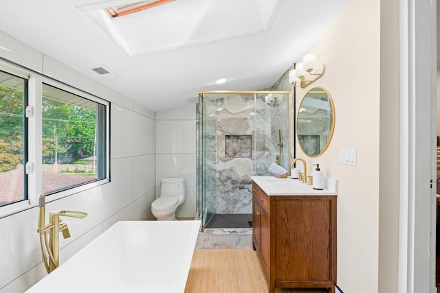 605 Home Ave, Oak Park, IL 60304 - full bathroom with vanity, a freestanding bath, a marble finish shower, and tile walls