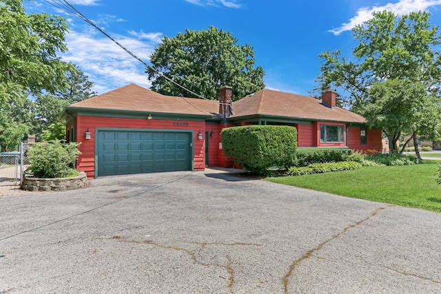 26435 N US Highway 45, Mundelein, IL 60060 - view of front of home with concrete driveway, a chimney, and an attached garage