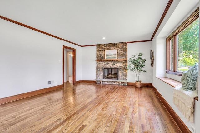26435 N US Highway 45, Mundelein, IL 60060 - unfurnished living room featuring light wood finished floors, ornamental molding, and a brick fireplace