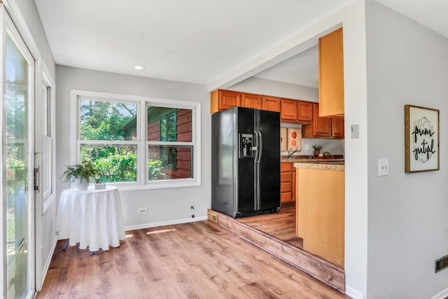 26435 N US Highway 45, Mundelein, IL 60060 - kitchen featuring black fridge with ice dispenser, light wood-style flooring, brown cabinets, and recessed lighting