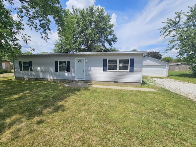 508 W Clark St, Thomasboro, IL 61878 - ranch-style house with crawl space, a front lawn, a garage, and an outbuilding