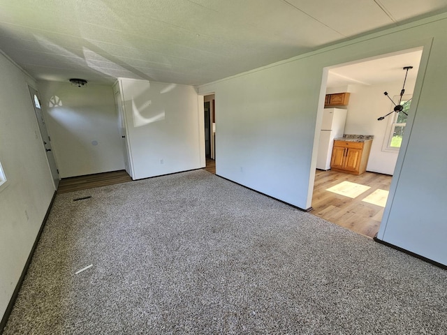 508 W Clark St, Thomasboro, IL 61878 - spare room with light colored carpet and light wood-style floors