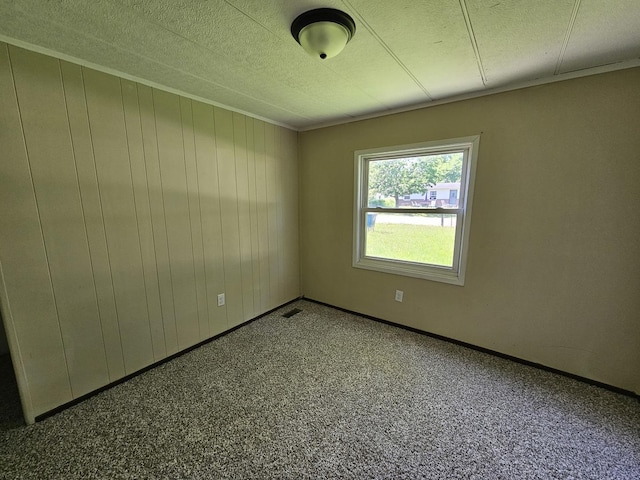 508 W Clark St, Thomasboro, IL 61878 - carpeted spare room with a textured ceiling and baseboards