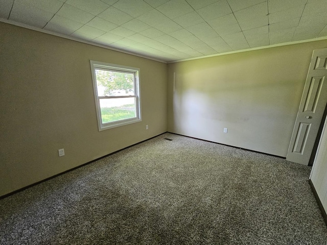 508 W Clark St, Thomasboro, IL 61878 - carpeted empty room with crown molding and baseboards