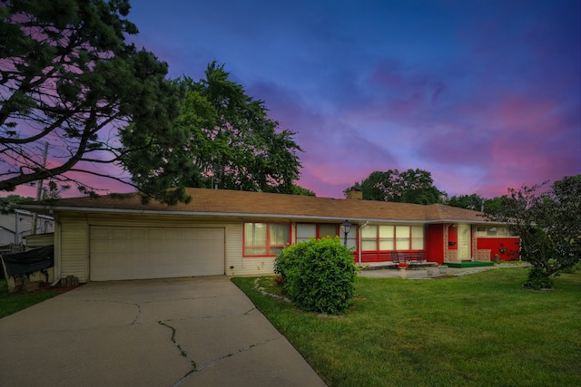 16632 Emerald Ave, Harvey, IL 60426 - ranch-style home with an attached garage, driveway, a yard, and a chimney