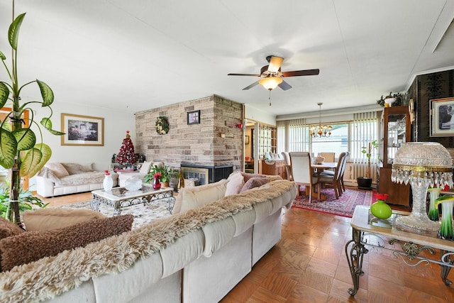 16632 Emerald Ave, Harvey, IL 60426 - living area featuring a ceiling fan, a chandelier, and a stone fireplace