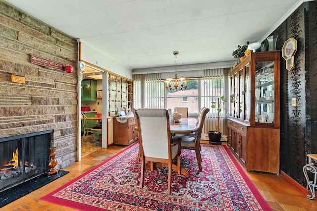 16632 Emerald Ave, Harvey, IL 60426 - dining space featuring a chandelier and a stone fireplace