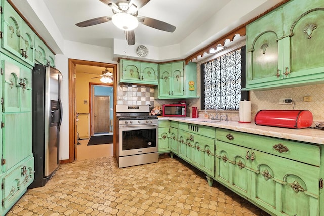 16632 Emerald Ave, Harvey, IL 60426 - kitchen featuring appliances with stainless steel finishes, green cabinets, ceiling fan, and light countertops