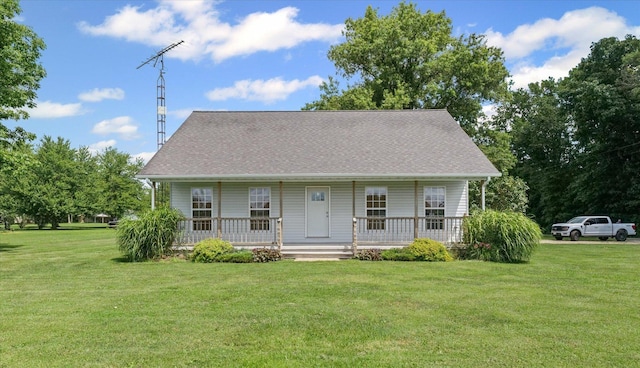 21 County Road 1200 N, Neoga, IL 62447 - view of front of property with a porch, a front yard, and roof with shingles
