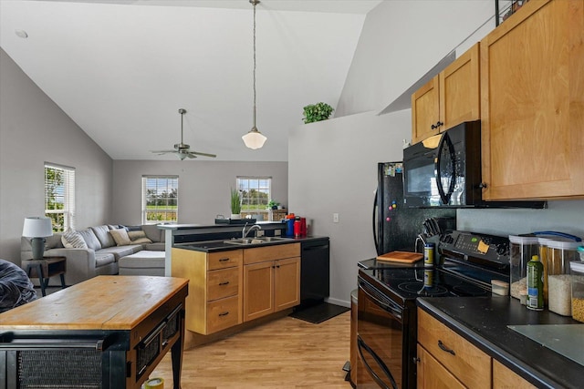 21 County Road 1200 N, Neoga, IL 62447 - kitchen featuring black appliances, open floor plan, light wood-style flooring, a peninsula, and a ceiling fan