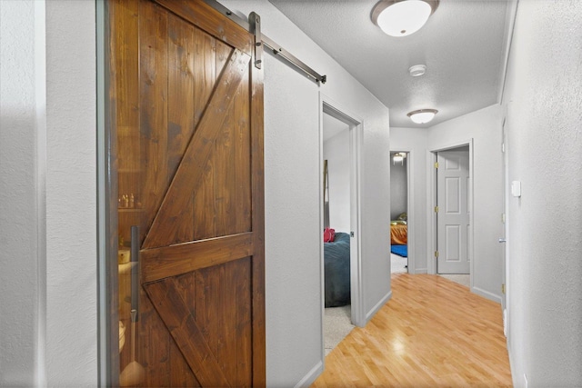 21 County Road 1200 N, Neoga, IL 62447 - hall with a barn door and wood finished floors