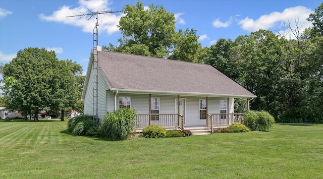 21 County Road 1200 N, Neoga, IL 62447 - view of front of property featuring a porch, a front lawn, and roof with shingles