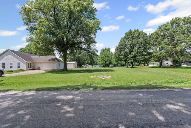 21 County Road 1200 N, Neoga, IL 62447 - view of grassy yard with an attached garage