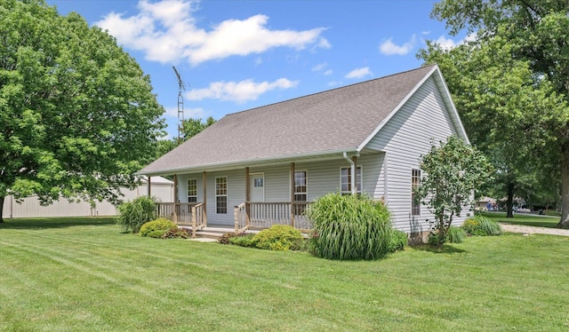 21 County Road 1200 N, Neoga, IL 62447 - view of front of property with a front lawn, covered porch, and a shingled roof
