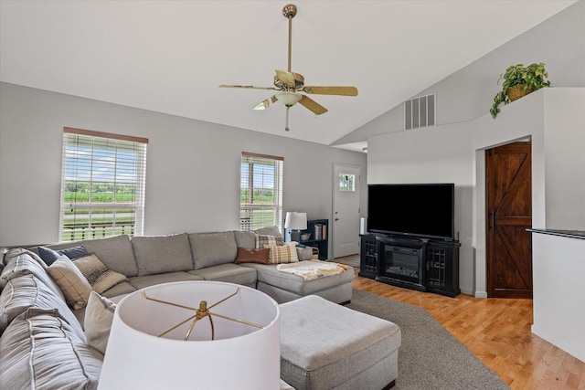 21 County Road 1200 N, Neoga, IL 62447 - living room with light wood-style flooring, ceiling fan, and high vaulted ceiling
