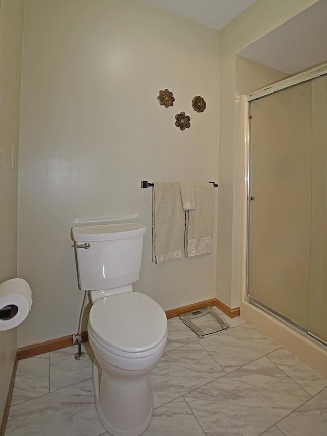 6924 Cody Ln, Rockford, IL 61107 - bathroom featuring marble look tiles and a shower stall