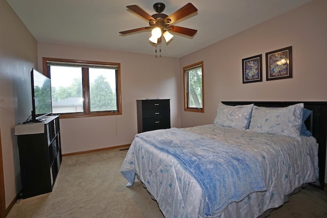 6924 Cody Ln, Rockford, IL 61107 - bedroom with light carpet and a ceiling fan