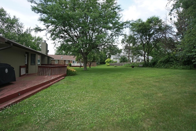 6924 Cody Ln, Rockford, IL 61107 - view of green lawn featuring a wooden deck