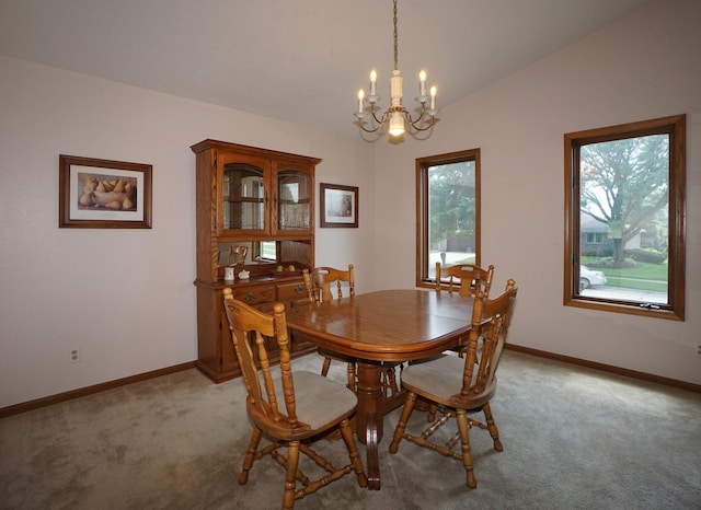6924 Cody Ln, Rockford, IL 61107 - dining space with a chandelier, light carpet, and lofted ceiling