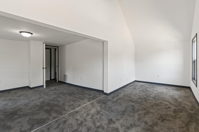 1213 W Fourth St, Dixon, IL 61021 - spare room featuring dark carpet and a towering ceiling