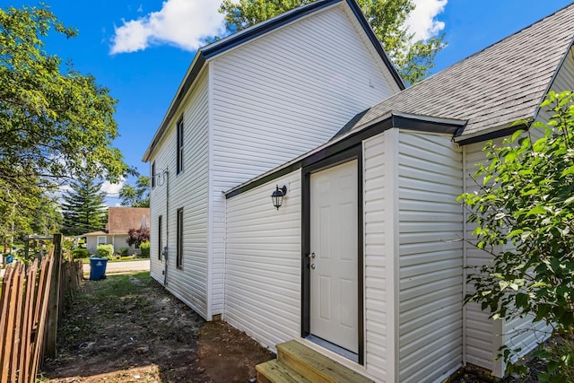 1213 W Fourth St, Dixon, IL 61021 - view of side of home with entry steps and a shingled roof