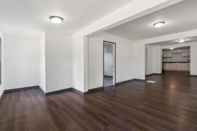 1213 W Fourth St, Dixon, IL 61021 - unfurnished living room featuring dark wood finished floors