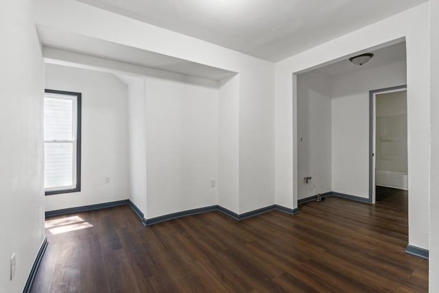 1213 W Fourth St, Dixon, IL 61021 - spare room featuring dark wood-style flooring and baseboard heating