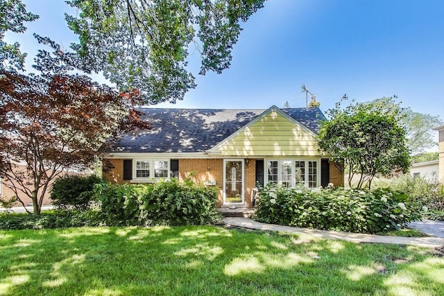 210 N Russel St, Mount Prospect, IL 60056 - view of front facade with brick siding, a front yard, and roof with shingles