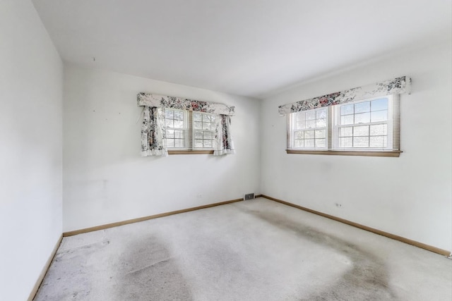 210 N Russel St, Mount Prospect, IL 60056 - spare room with healthy amount of natural light and carpet flooring