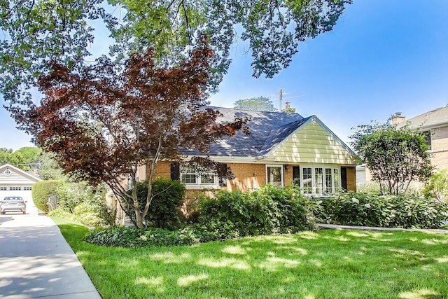 210 N Russel St, Mount Prospect, IL 60056 - view of front of home featuring brick siding, a front yard, a garage, and a shingled roof