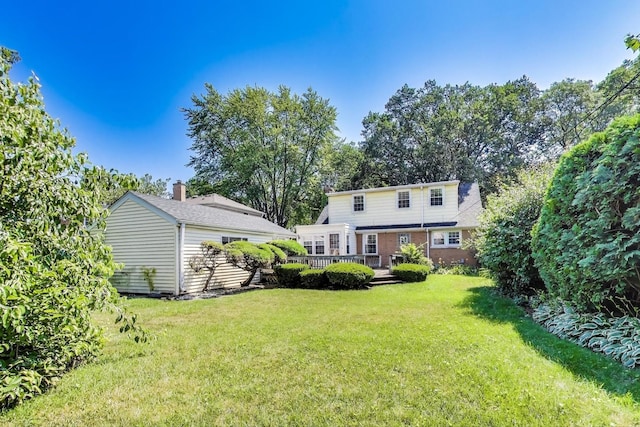 210 N Russel St, Mount Prospect, IL 60056 - view of green lawn featuring a wooden deck
