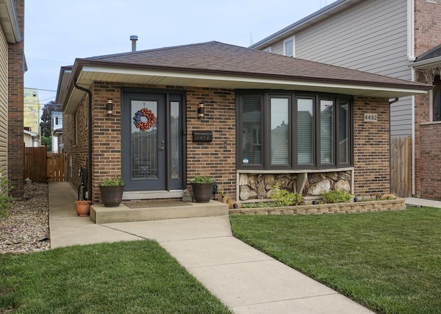 4452 N Newland Ave, Harwood Heights, IL 60706 - property entrance featuring a shingled roof and brick siding
