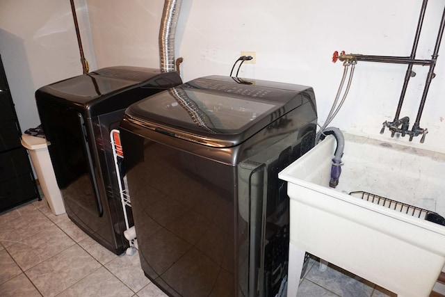 4452 N Newland Ave, Harwood Heights, IL 60706 - washroom with washing machine and clothes dryer and light tile patterned floors