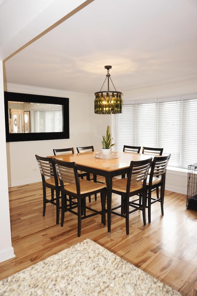 4452 N Newland Ave, Harwood Heights, IL 60706 - dining room with ornamental molding, light wood-type flooring, and a chandelier