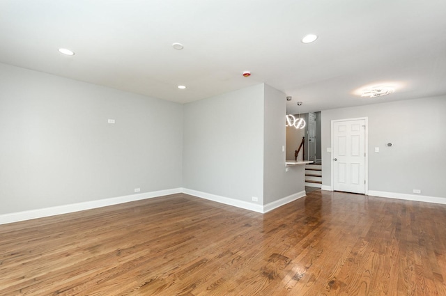 1203 W 110th St, Chicago, IL 60643 - spare room featuring stairs, wood finished floors, and recessed lighting