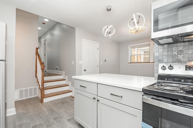 1203 W 110th St, Chicago, IL 60643 - kitchen with appliances with stainless steel finishes, recessed lighting, light countertops, white cabinets, and pendant lighting
