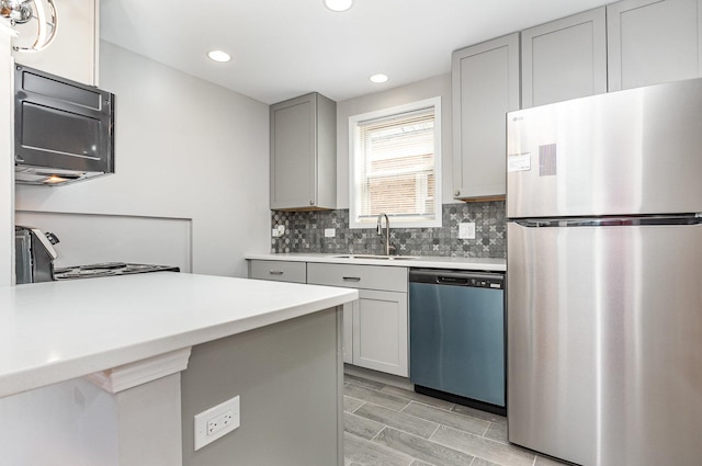 1203 W 110th St, Chicago, IL 60643 - kitchen featuring freestanding refrigerator, dishwasher, stove, gray cabinetry, and black microwave