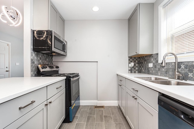 1203 W 110th St, Chicago, IL 60643 - kitchen featuring stainless steel appliances, tasteful backsplash, light countertops, light wood-type flooring, and recessed lighting