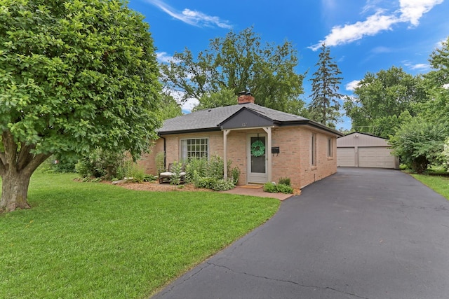 137 School St, Grayslake, IL 60030 - single story home featuring a garage, brick siding, an outdoor structure, and a front yard