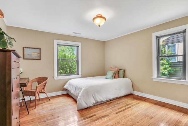137 School St, Grayslake, IL 60030 - bedroom featuring light wood-style flooring and crown molding