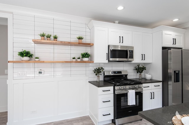 7945 S Avalon Ave, Chicago, IL 60619 - kitchen with appliances with stainless steel finishes, open shelves, light wood-style floors, white cabinets, and recessed lighting