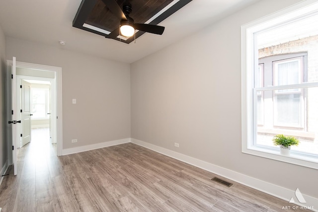 7945 S Avalon Ave, Chicago, IL 60619 - spare room with a ceiling fan and light wood-type flooring