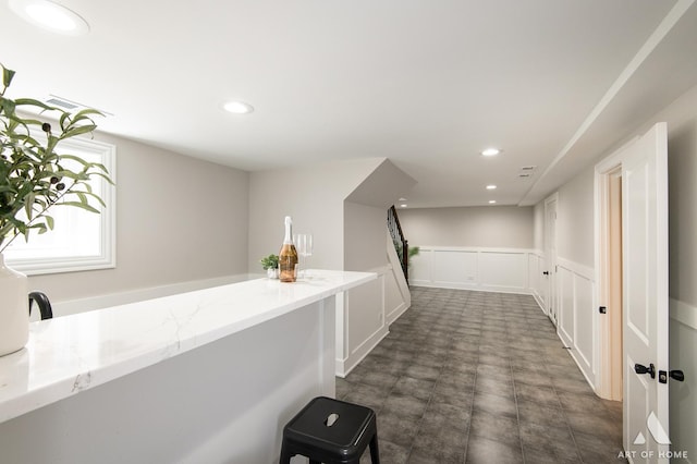 7945 S Avalon Ave, Chicago, IL 60619 - hall with recessed lighting, a decorative wall, and a wainscoted wall