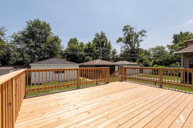 7945 S Avalon Ave, Chicago, IL 60619 - deck featuring an outbuilding and a lawn