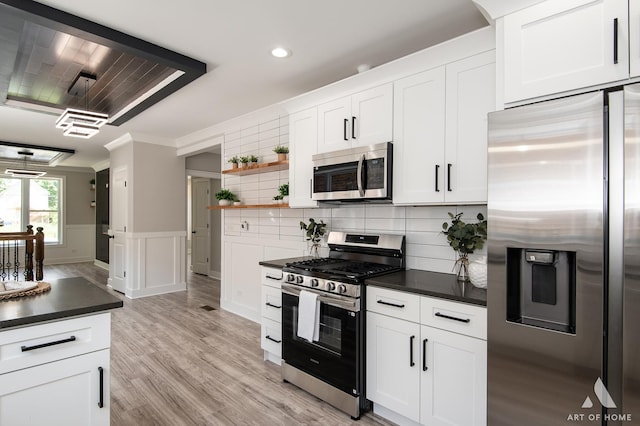 7945 S Avalon Ave, Chicago, IL 60619 - kitchen featuring stainless steel appliances, dark countertops, recessed lighting, open shelves, and white cabinetry