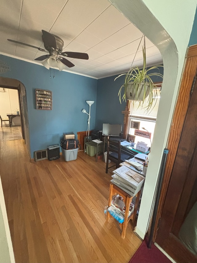 4304 N Oriole Ave, Norridge, IL 60706 - office featuring arched walkways, a ceiling fan, and wood finished floors