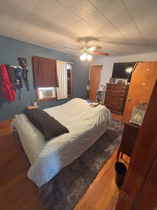 4304 N Oriole Ave, Norridge, IL 60706 - bedroom with wood finished floors, cooling unit, and a ceiling fan
